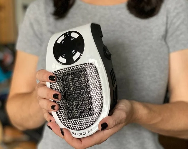 woman holding Ultra Heater Pro